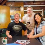 Scott Mann and Renee Blaine pose for photographs with fans
